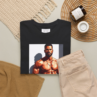 Folded short-sleeve crewneck t-shirt featuring a large graphic print on the front of a gay black muscular male bodybuilder posing in gray briefs. Designed and sold in The Pink Rocket New Orleans gift shop.