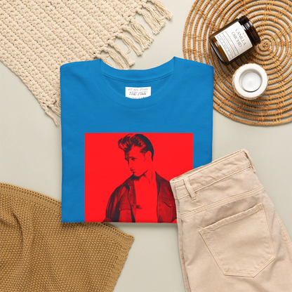 A folded baby blue short-sleeve t-shirt with a graphic print of a gay muscular man wearing a Versace shirt in a 1990s ad. Designed and for sale in The Pink Rocket New Orleans gay gift shop.
