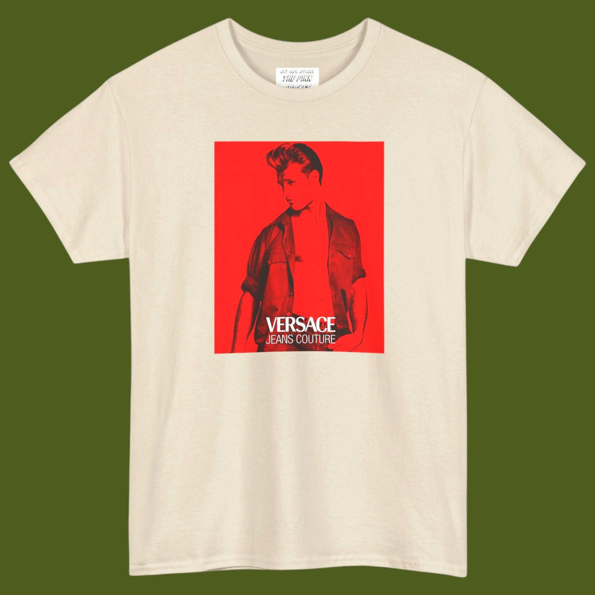 A off white short-sleeve t-shirt with a graphic print of a gay muscular man wearing a Versace shirt in a 1990s ad. Designed and for sale in The Pink Rocket New Orleans gay gift shop.
