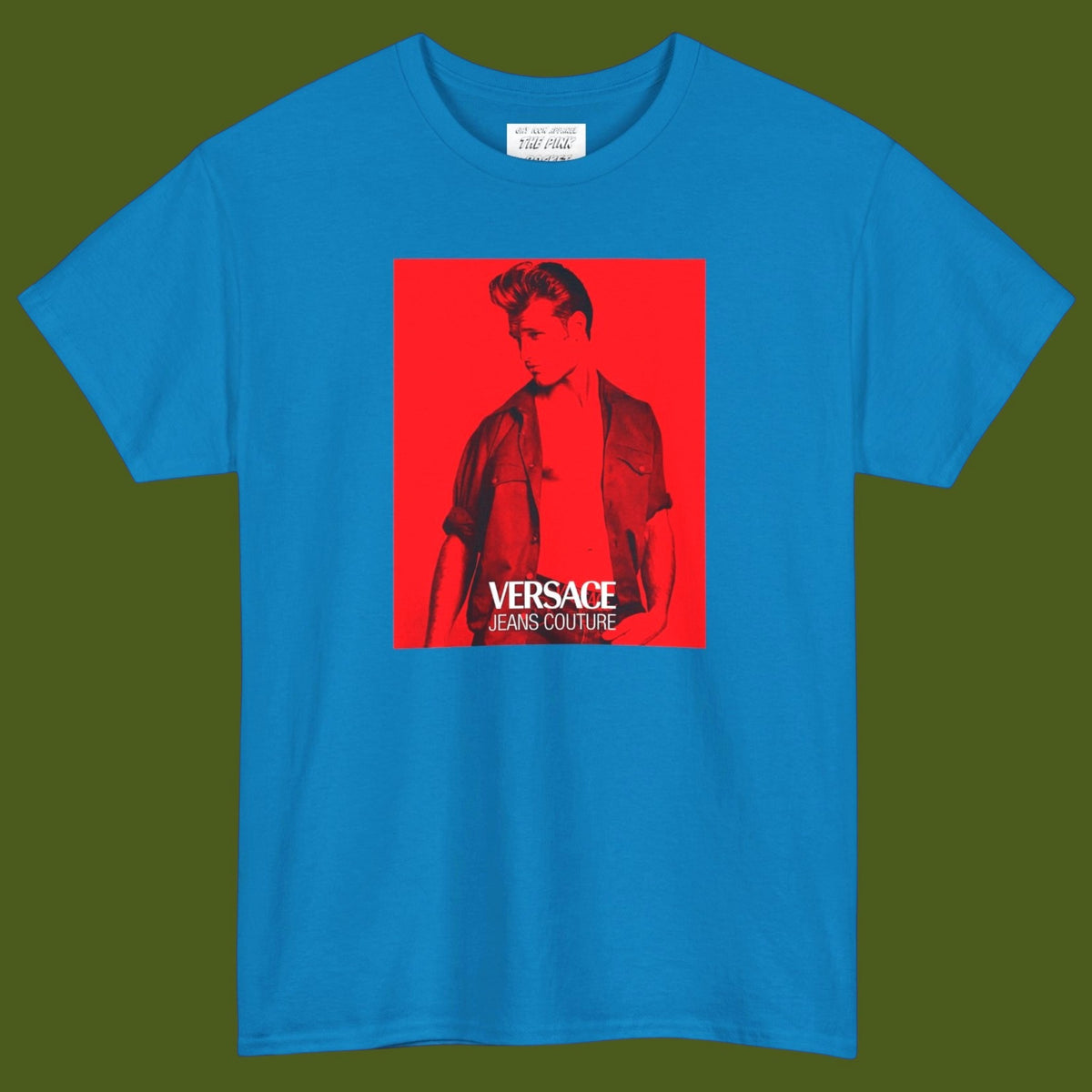 A baby blue short-sleeve t-shirt with a graphic print of a gay muscular man wearing a Versace shirt in a 1990s ad. Designed and for sale in The Pink Rocket New Orleans gay gift shop.