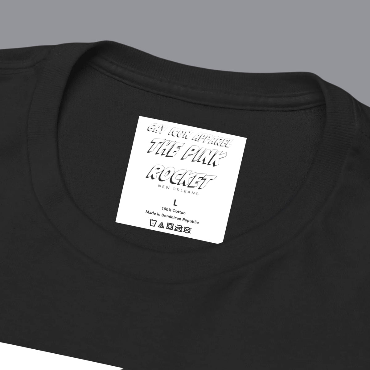 Closeup of a black short-sleeve crewneck t-shirt featuring a large graphic print on the front of a gay black muscular male bodybuilder posing in gray briefs. Designed and sold in The Pink Rocket New Orleans gift shop.
