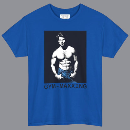 A heather royal blue short-sleeve t-shirt with a graphic print of a gay muscular shirtless man wearing blue pants, with the text 'GYM-MAXXING' printed below the graphic. Deswigned and for sale in The Pink Rocket New Orleans gay gift shop.
