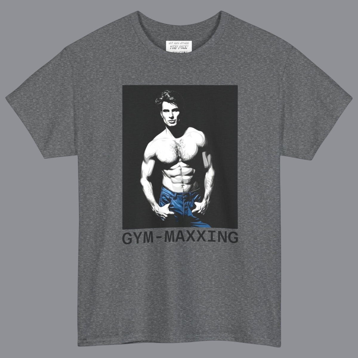 A heather gray short-sleeve t-shirt with a graphic print of a gay muscular shirtless man wearing blue pants, with the text 'GYM-MAXXING' printed below the graphic. Designed and for sale in The Pink Rocket New Orleans gay gift shop.
