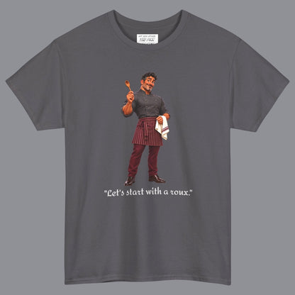 A gray short-sleeve t-shirt with a graphic of a gay male chef  in a holding a wooden spoon with the text "Let's Start With A Roux" printed below in off white letters. Designed and for sale in The Pink Rocket New Orleans gay gift shop.
