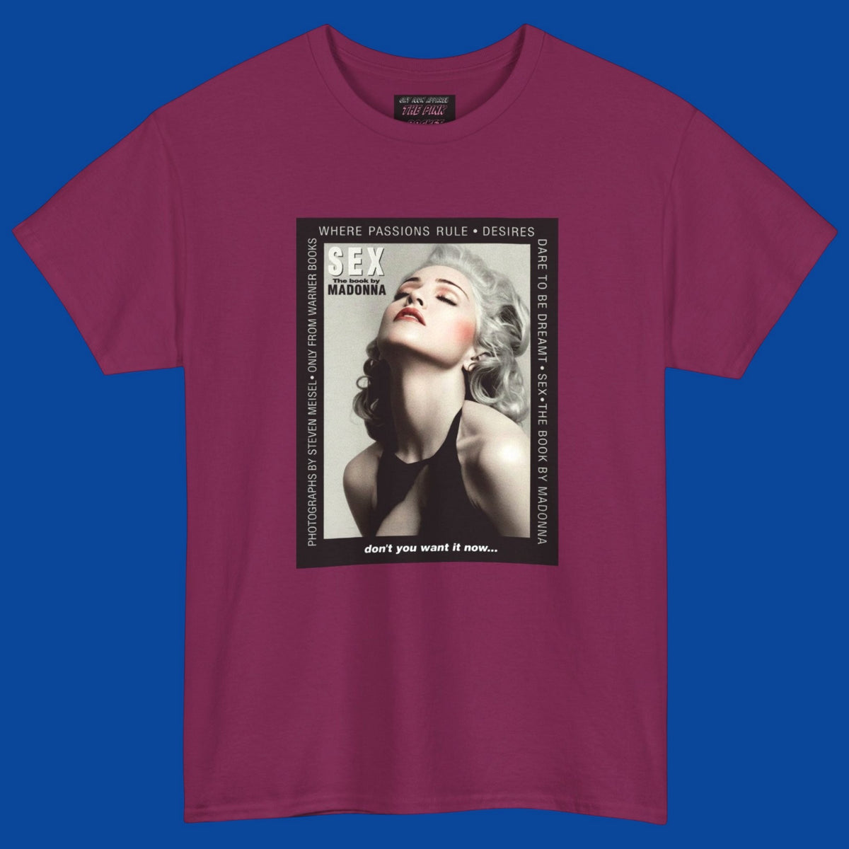 A berry color short-sleeve t-shirt with a large rectangular graphic print on the front of Madonna advertising her 1992 SEX book. Pick it up in The Pink Rocket New Orleans.