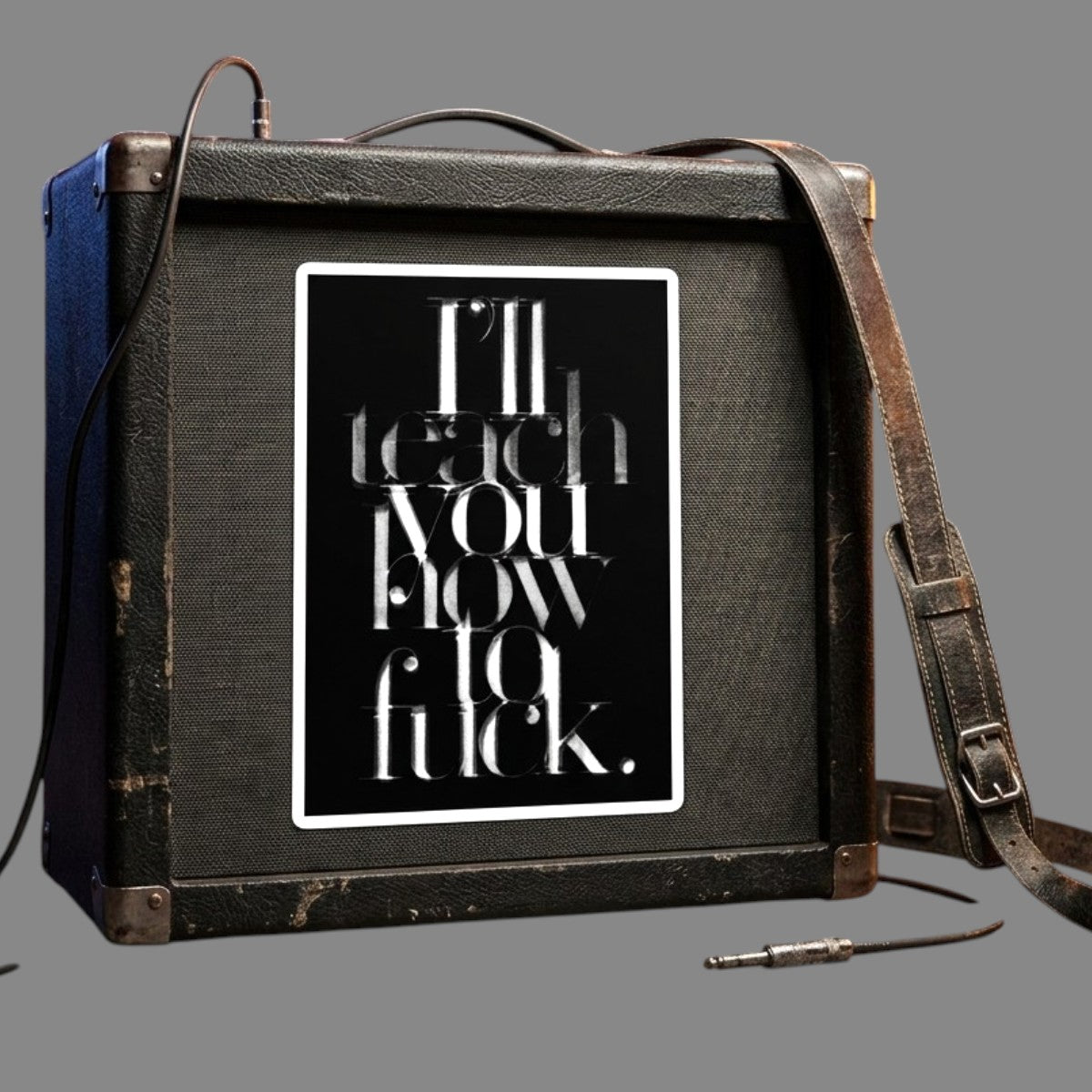 A typographic vinyl sticker on an amp featuring the text 'I'll teach you how to fuck.' in layered white lettering on a black background, with a thin white border around the print. Available in The Pink Rocket New Orleans gay gift shop.